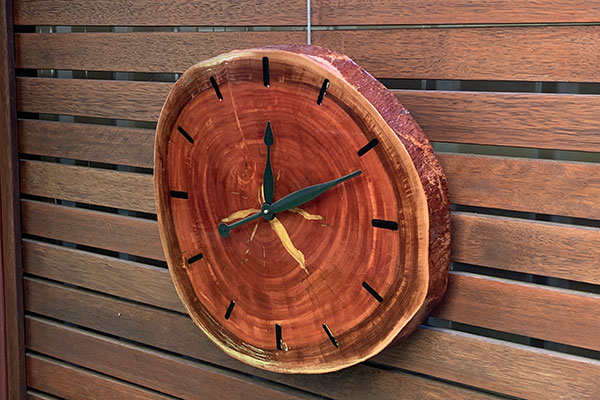 Outdoor clock made of salavaged timber and epoxy resin
