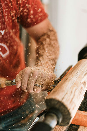 man using a lathe